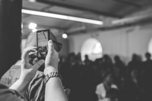 Women trying to video call during concert